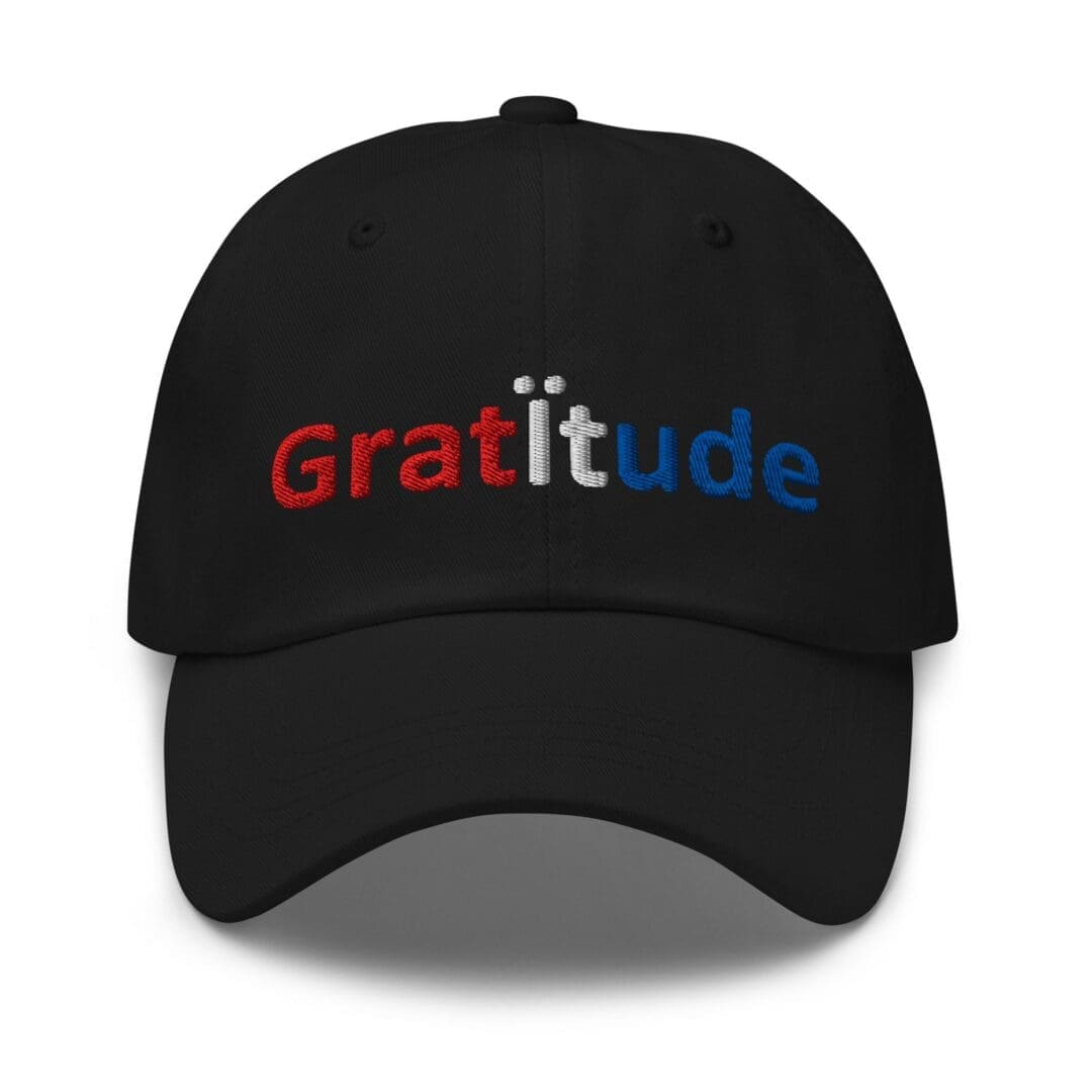 Black cap embroidered with gratitude text
