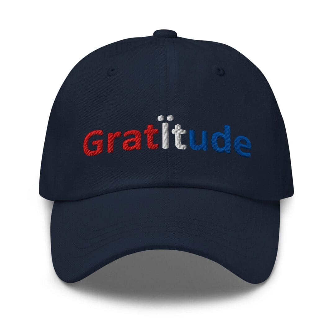 Navy cap embroidered with "Gratitude" text