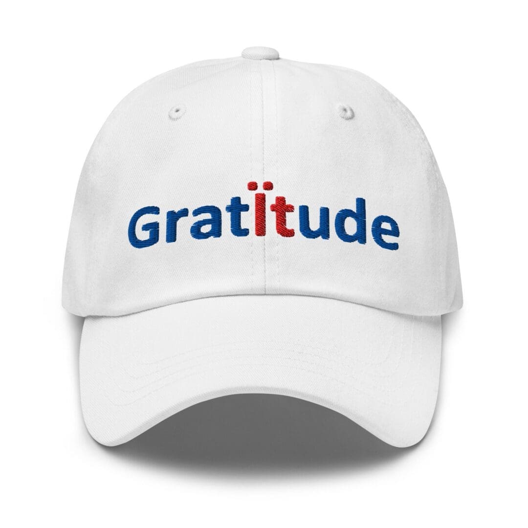 White baseball cap embroidered "Gratitude"
